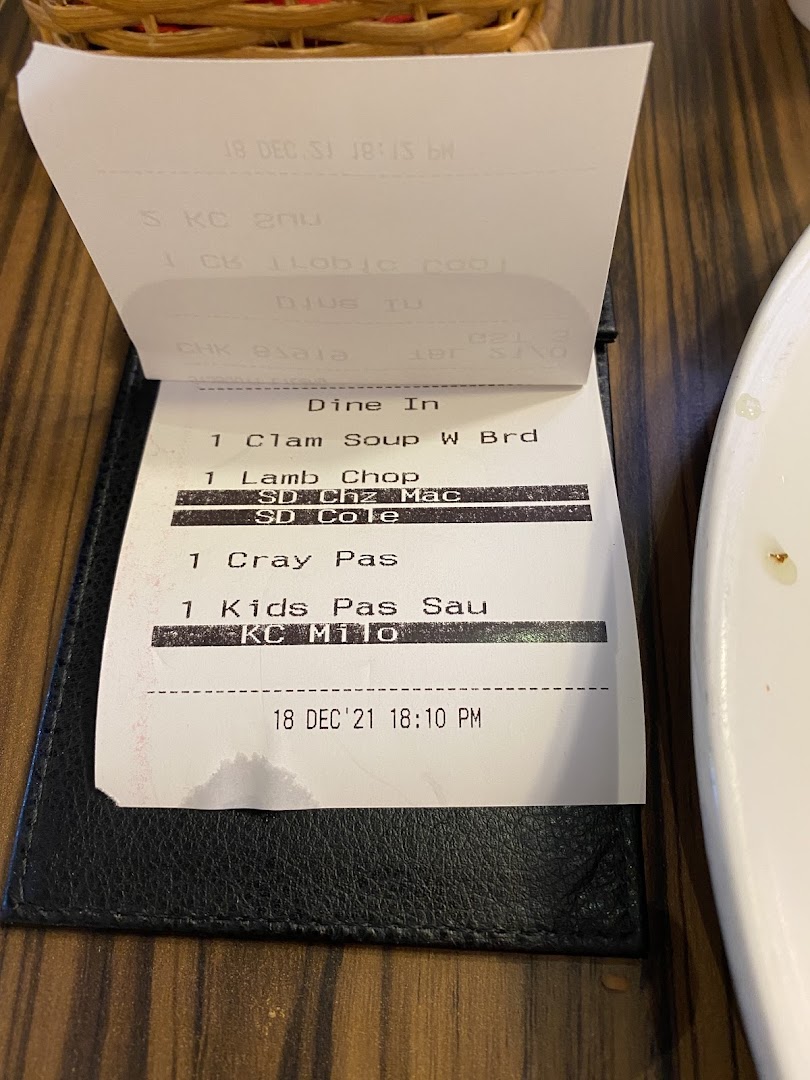A close-up of a restaurant order slip from Swensen's, detailing various food items ordered for dine-in.