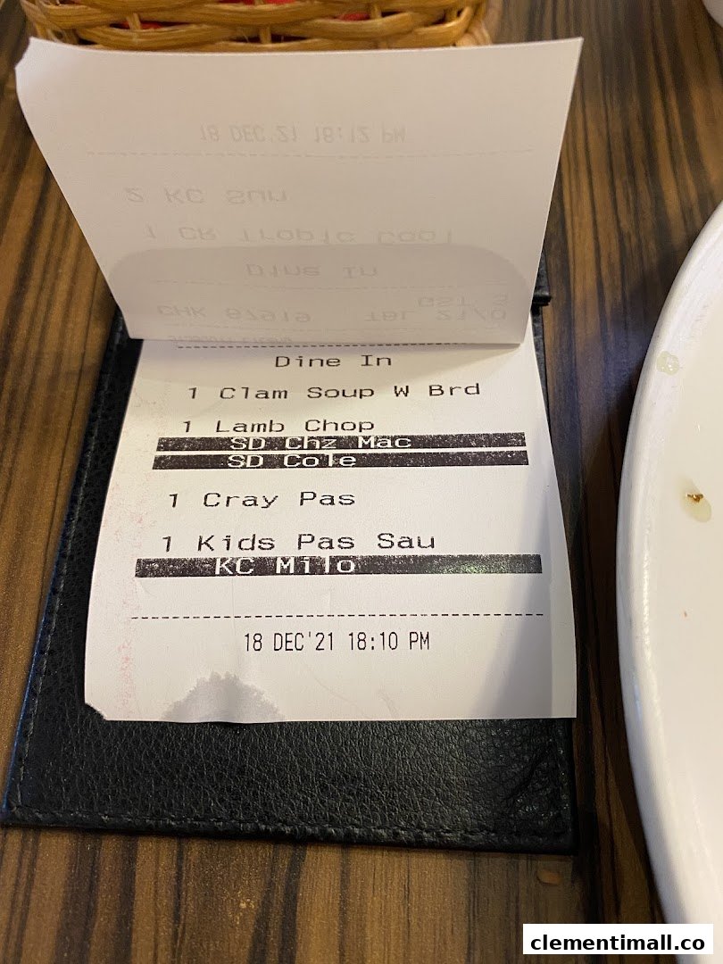 A close-up of a restaurant order slip from Swensen's, detailing various food items ordered for dine-in.