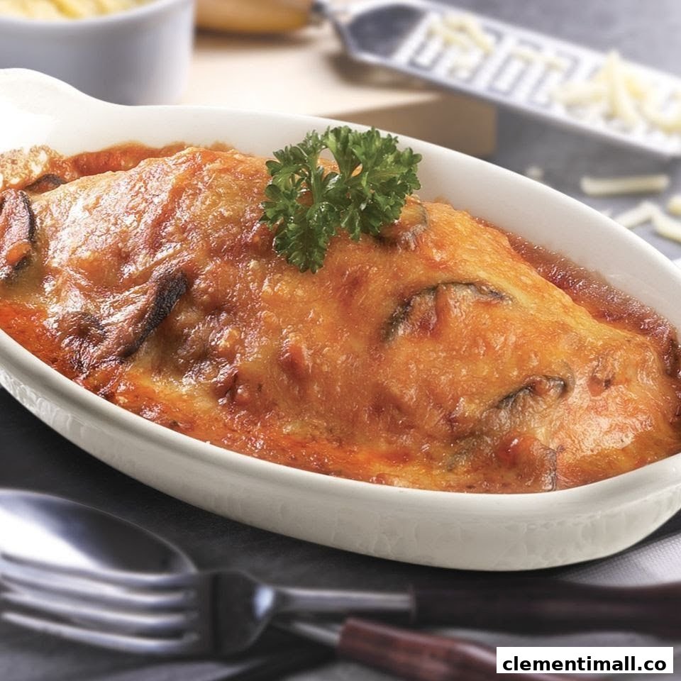 A close-up of a delicious baked pasta or casserole dish topped with melted cheese and parsley.