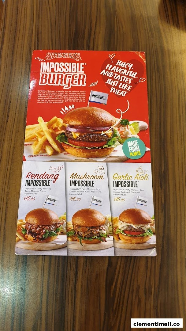 A Swensen's menu board showcasing their Impossible Burger range with various flavors.