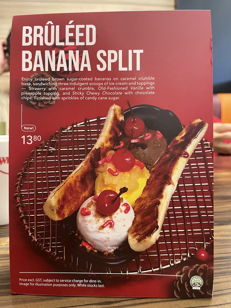 A menu board showcasing Swensen's new Brûléed Banana Split dessert with its description and price.