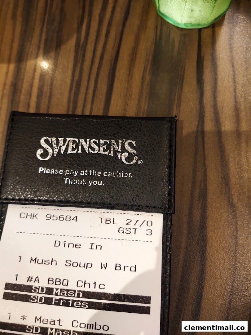 A close-up of a Swensen's restaurant bill showing ordered items like soup, BBQ chicken, and a meat combo.