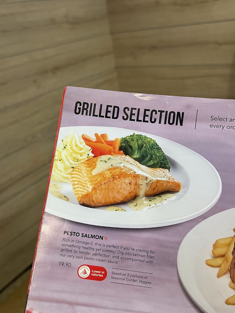 A menu page from Swensen's featuring a delicious Pesto Salmon dish under 'Grilled Selection'.
