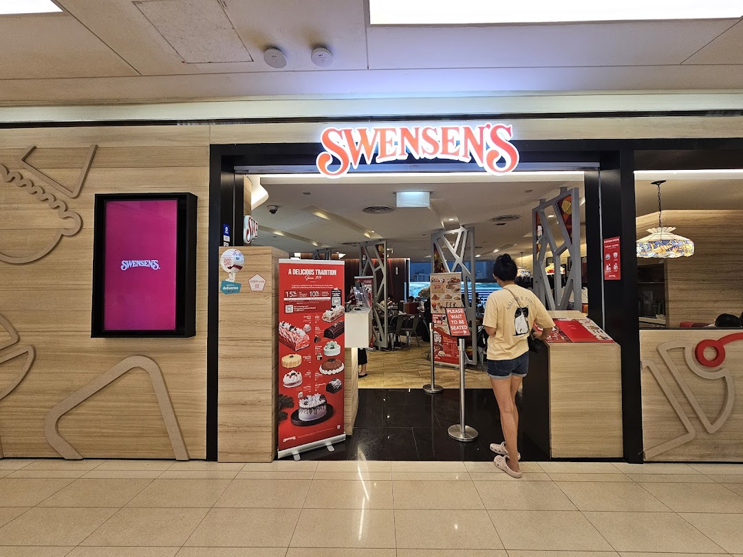 The vibrant entrance of Swensens at Clementi Mall, featuring its iconic signage and promotional displays.