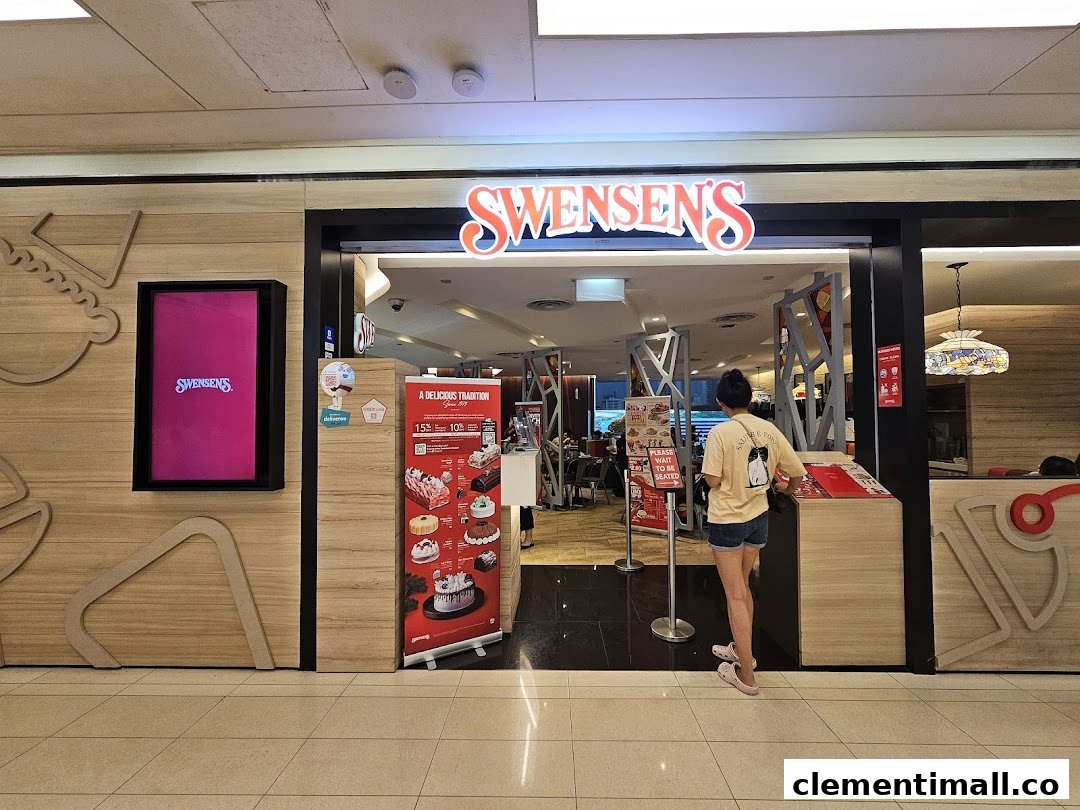 The vibrant entrance of Swensens at Clementi Mall, featuring its iconic signage and promotional displays.