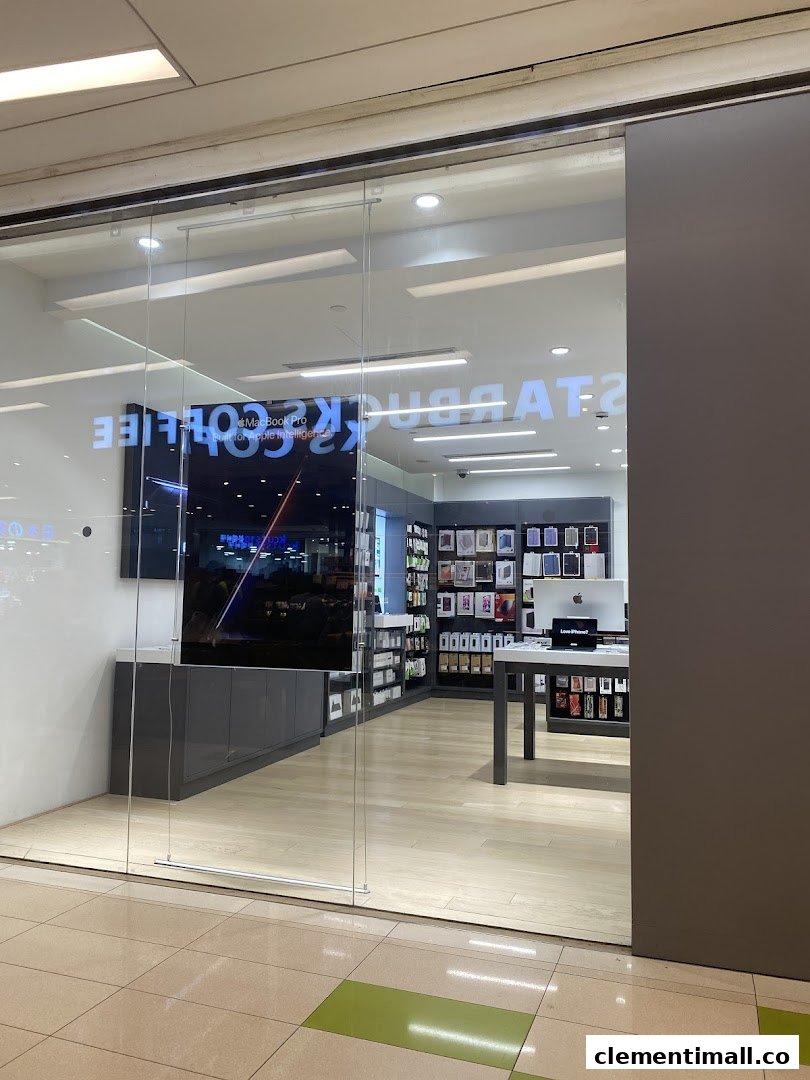 The glass entrance of Switch, an Apple Premium Reseller, showcasing Apple products and accessories.