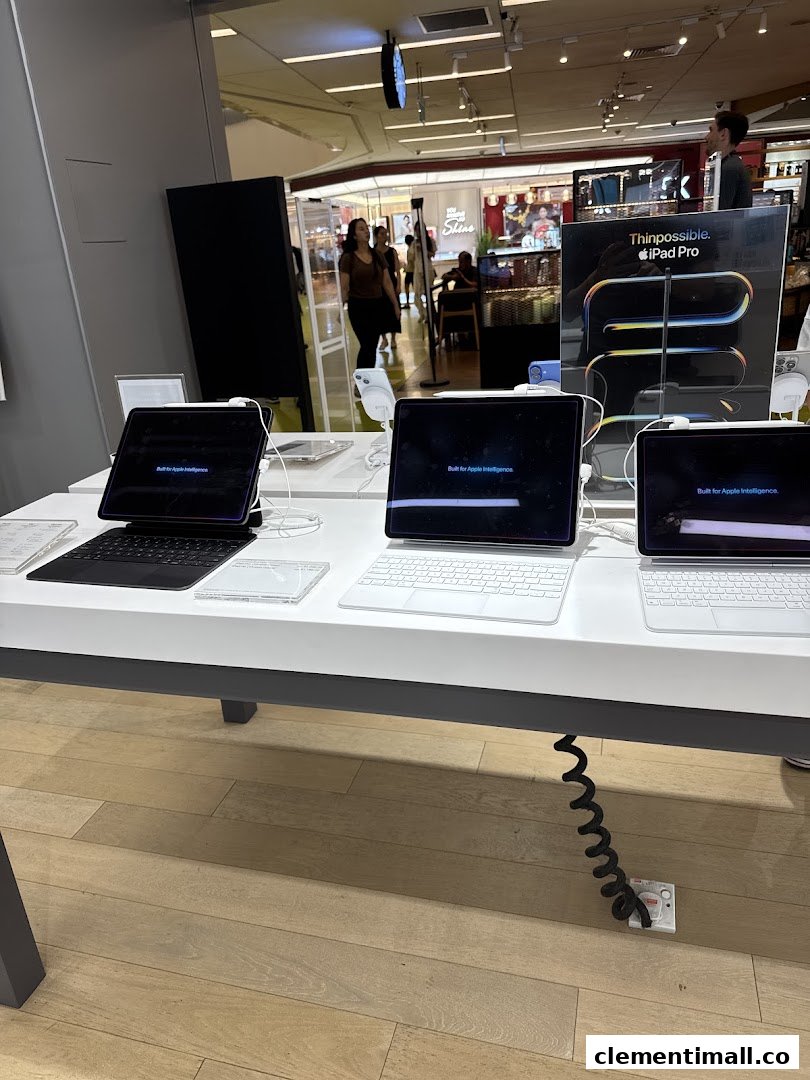 A display of Apple iPad Pro models with keyboards in a tech store.