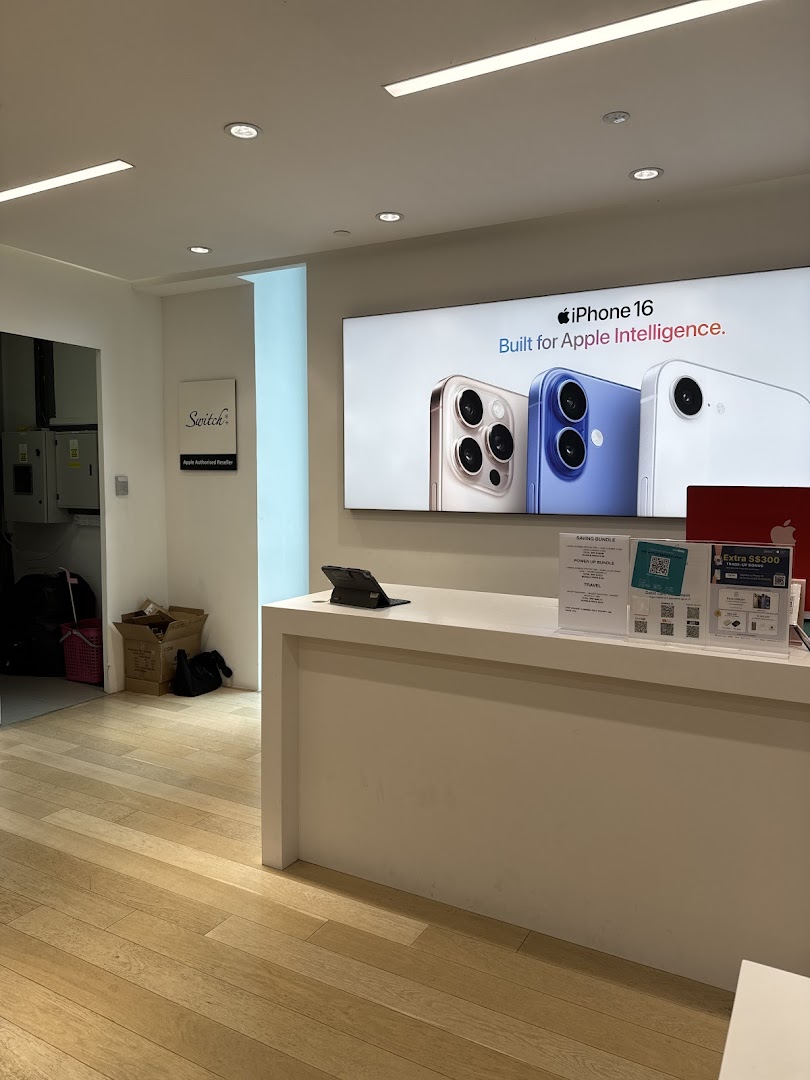 Interior view of Switch, an Apple Authorised Reseller, featuring an iPhone 16 display and service counter.