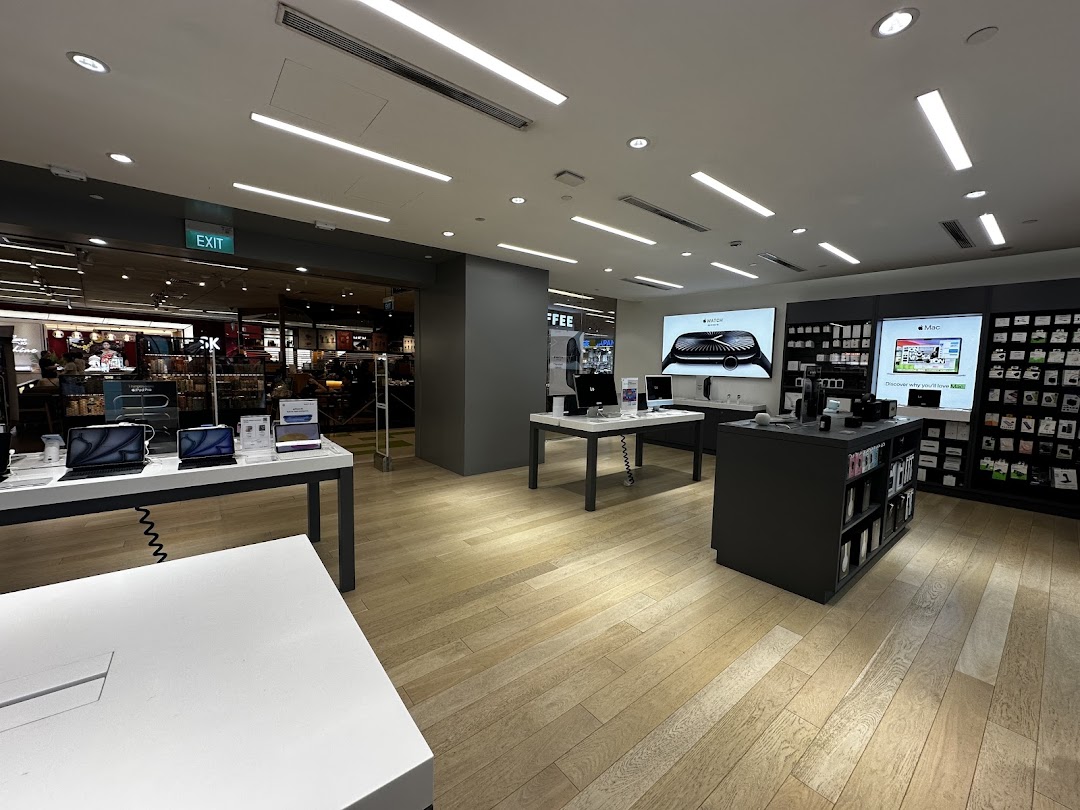 Interior of Switch Clementi Mall, showcasing Apple products like MacBooks, Apple Watch, and accessories on display.