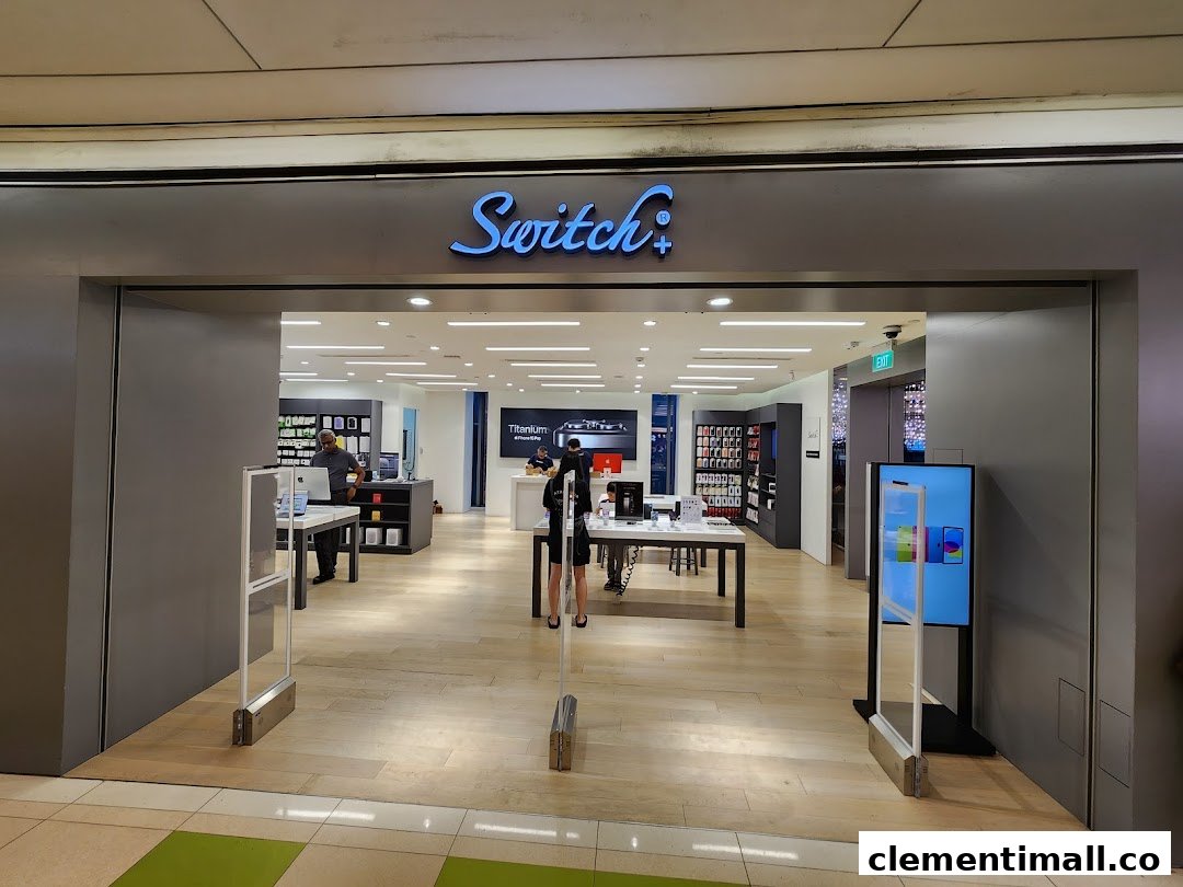The entrance of Switch, an electronics store, showcasing Apple products and a bright interior.