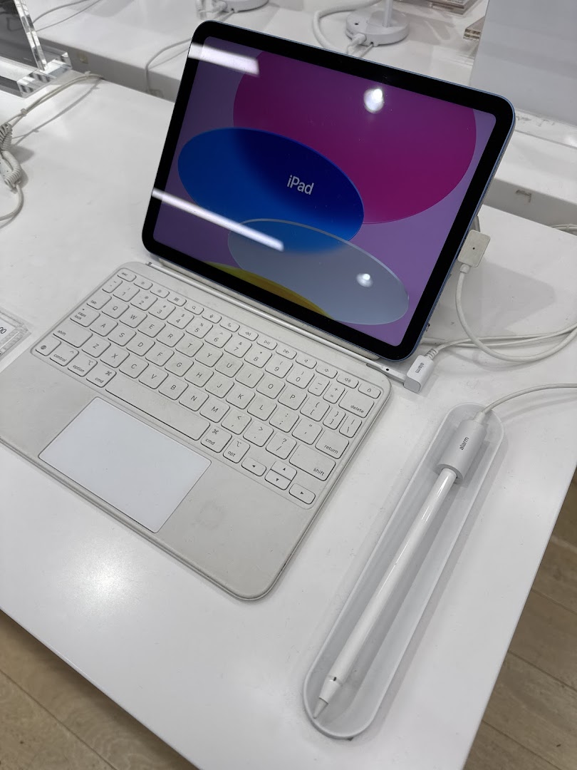 An Apple iPad with a keyboard case and Apple Pencil on display at Switch.