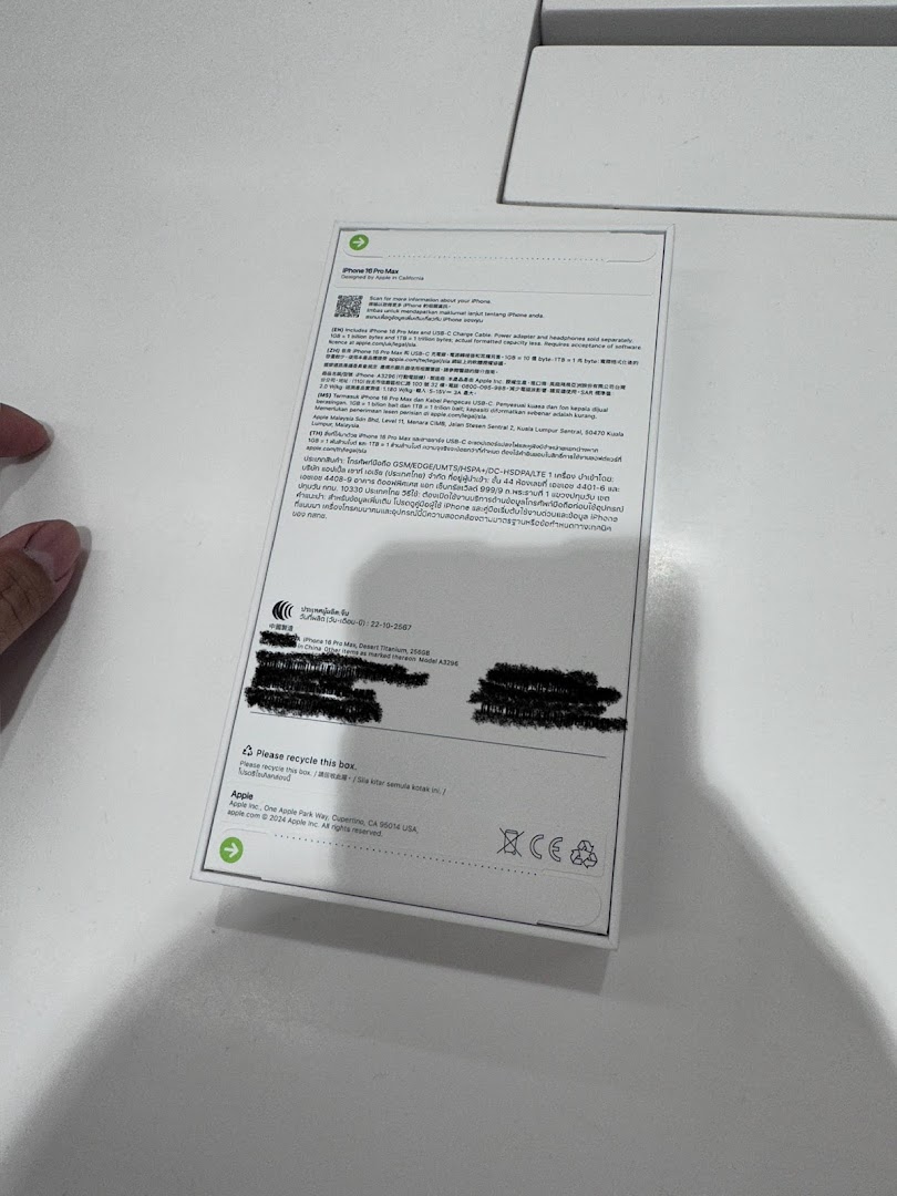 A close-up view of the back of an iPhone 16 Pro Max box, displaying product information and regulatory details.