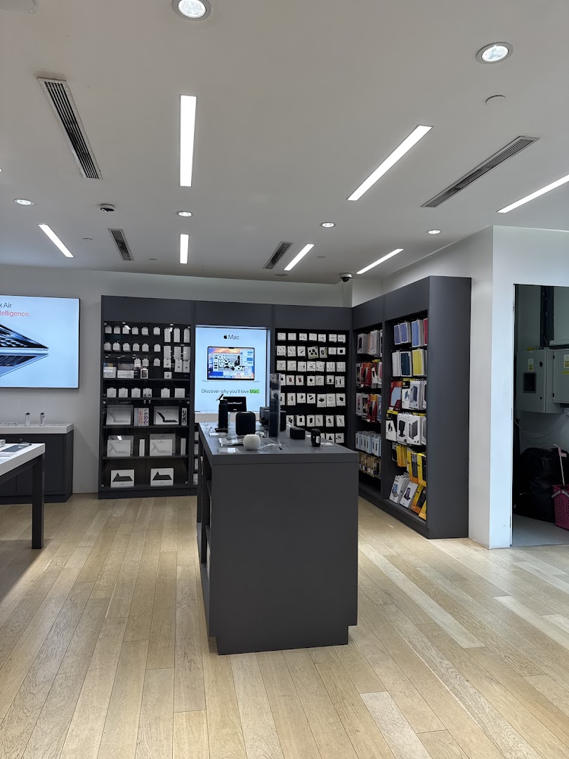 Interior view of Switch Clementi Mall, an electronics store showcasing Apple products and accessories.