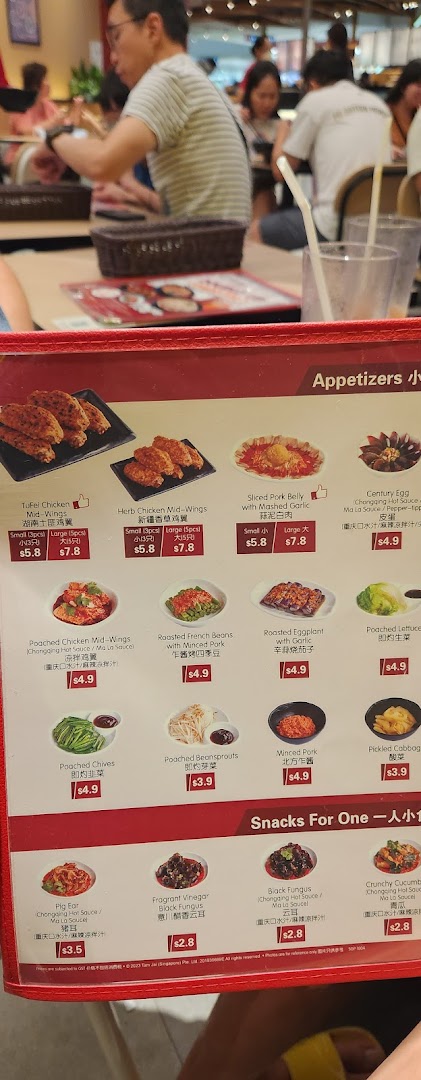 A close-up of TamJai SamGor Mixian's menu, featuring a variety of appetizers and snacks.