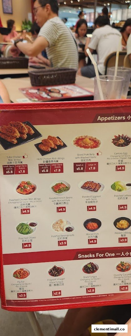 A close-up of TamJai SamGor Mixian's menu, featuring a variety of appetizers and snacks.