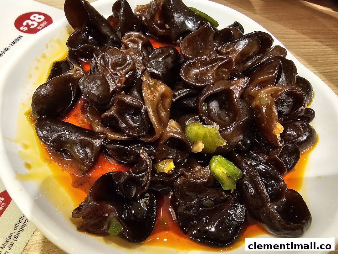 A close-up of a delicious plate of spicy wood ear mushrooms, a popular appetizer.