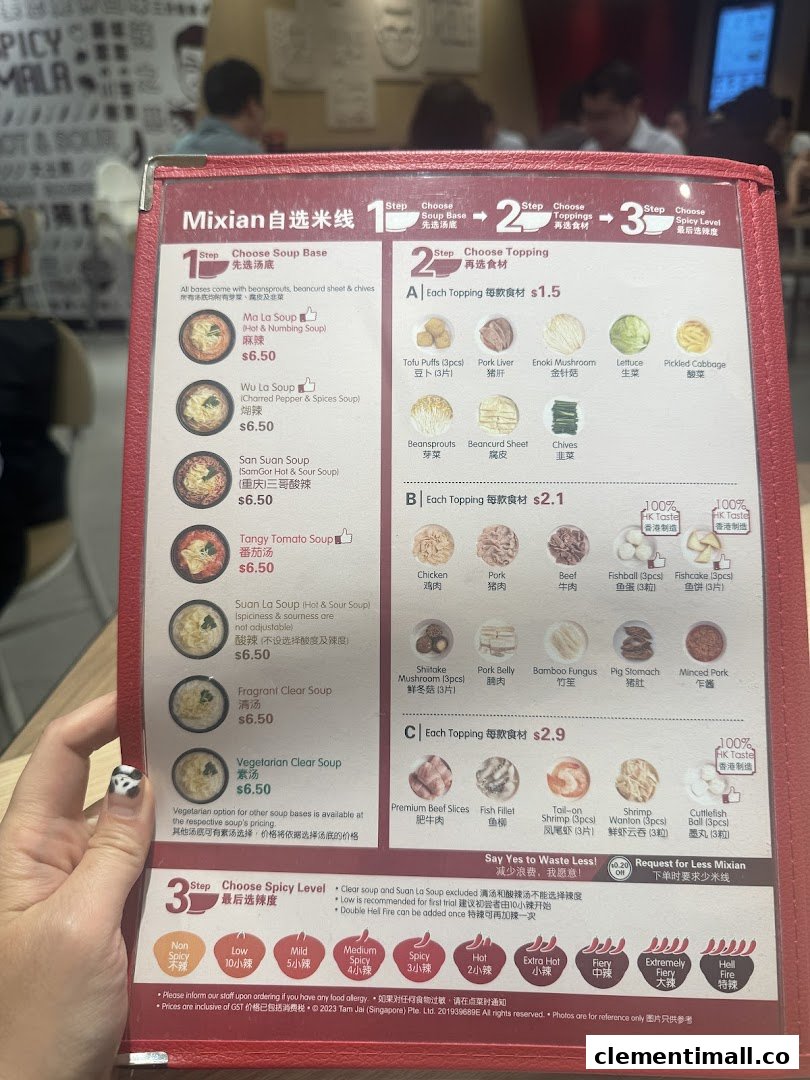 A close-up of a TamJai SamGor Mixian menu, detailing customizable soup bases, toppings, and spice levels.
