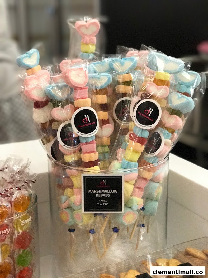 A vibrant display of colorful marshmallow kebabs from The Jelly Hearts, individually packaged for sale.