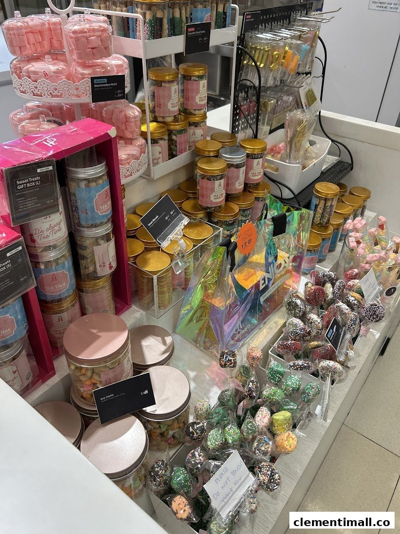 A vibrant display of various sweet treats, cookies, and gift items inside a confectionery shop.
