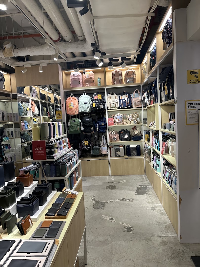 Interior view of The Wallet Shop, showcasing a wide array of wallets, bags, and accessories on display.