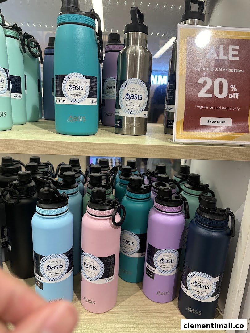 Colorful Oasis brand insulated water bottles are displayed on shelves with a 20% off sale sign.