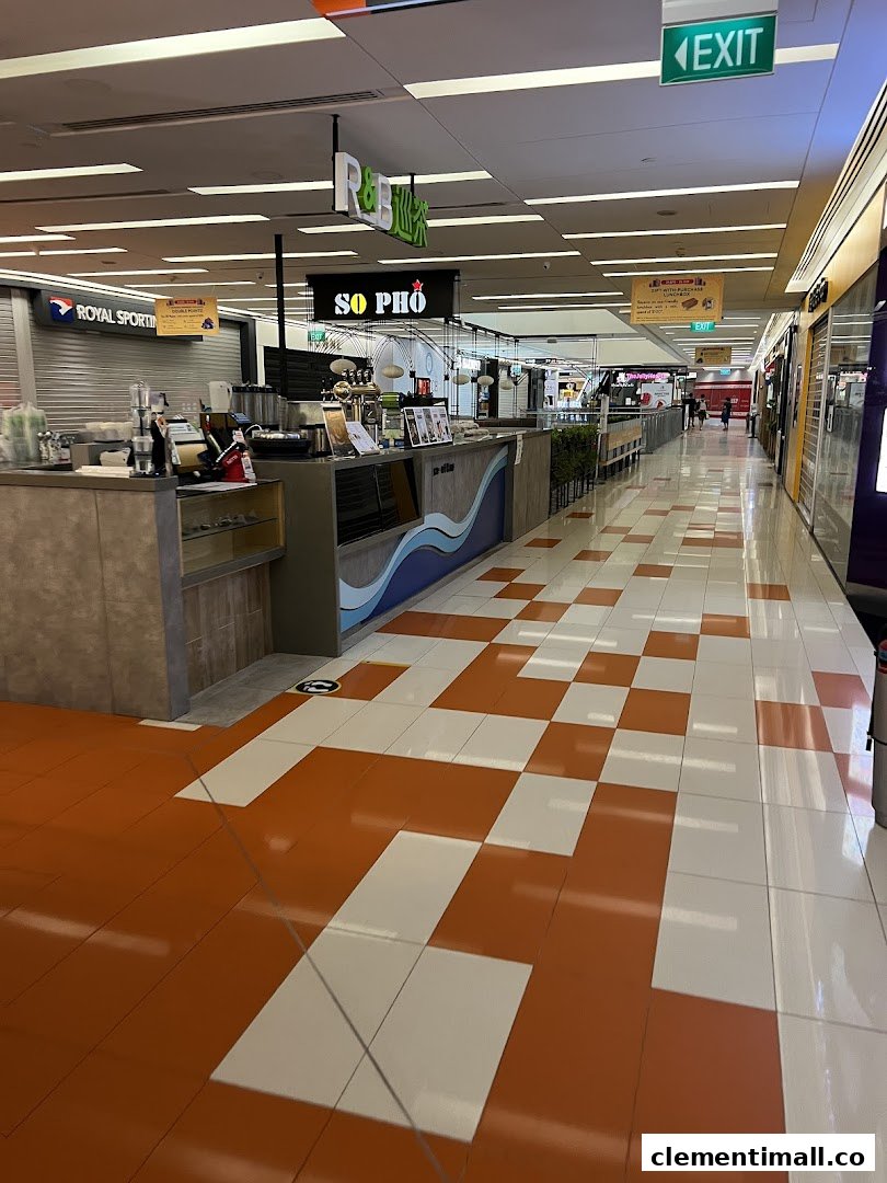 A wide view of a mall corridor featuring various retail and food outlets like So Pho and R&B.