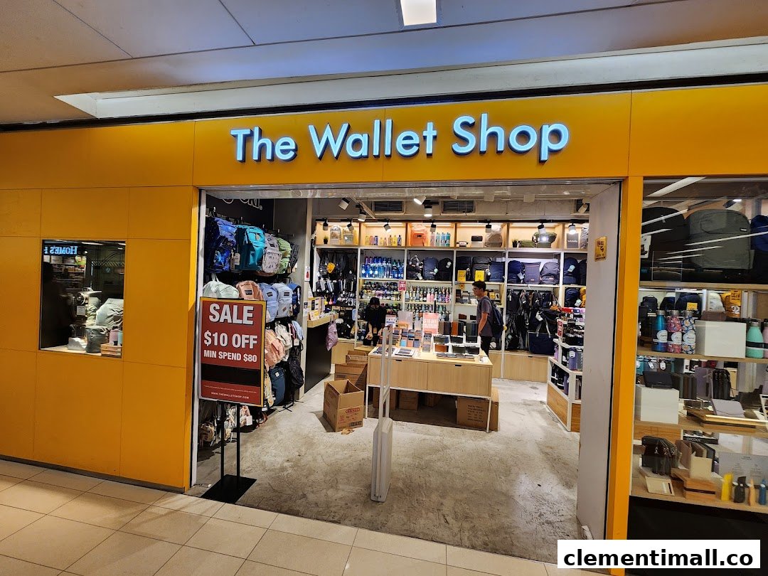 The storefront of The Wallet Shop, showcasing a wide array of wallets, bags, and accessories, with a sale sign.