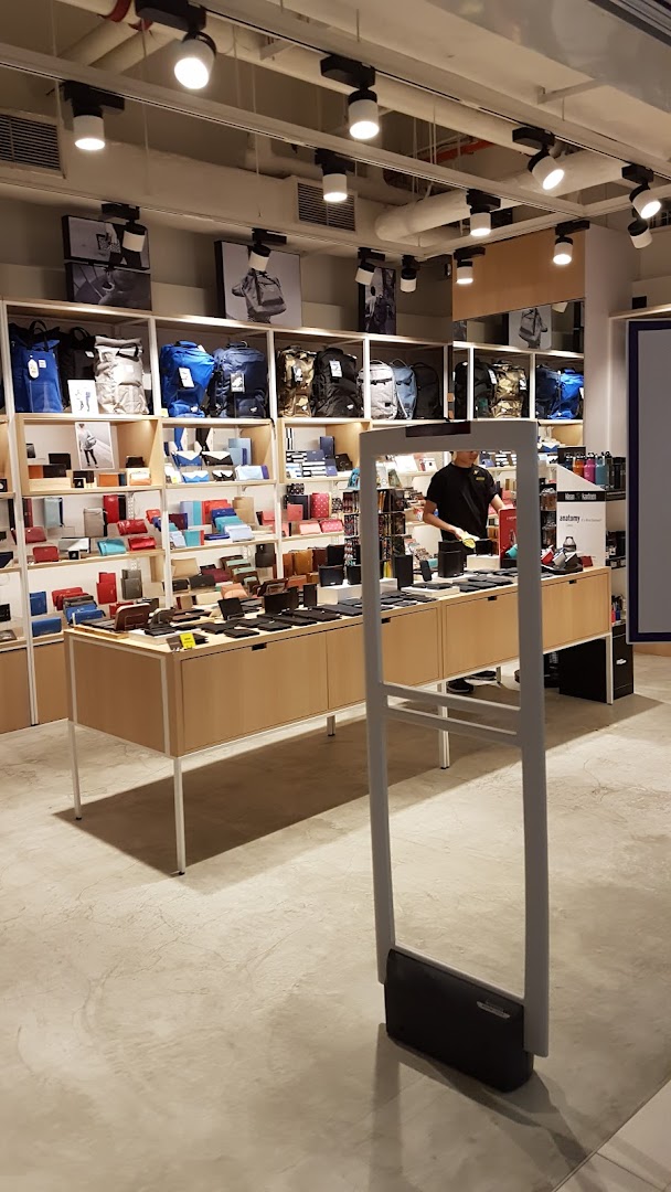 Interior view of The Wallet Shop, showcasing a wide array of wallets, bags, and accessories on display.