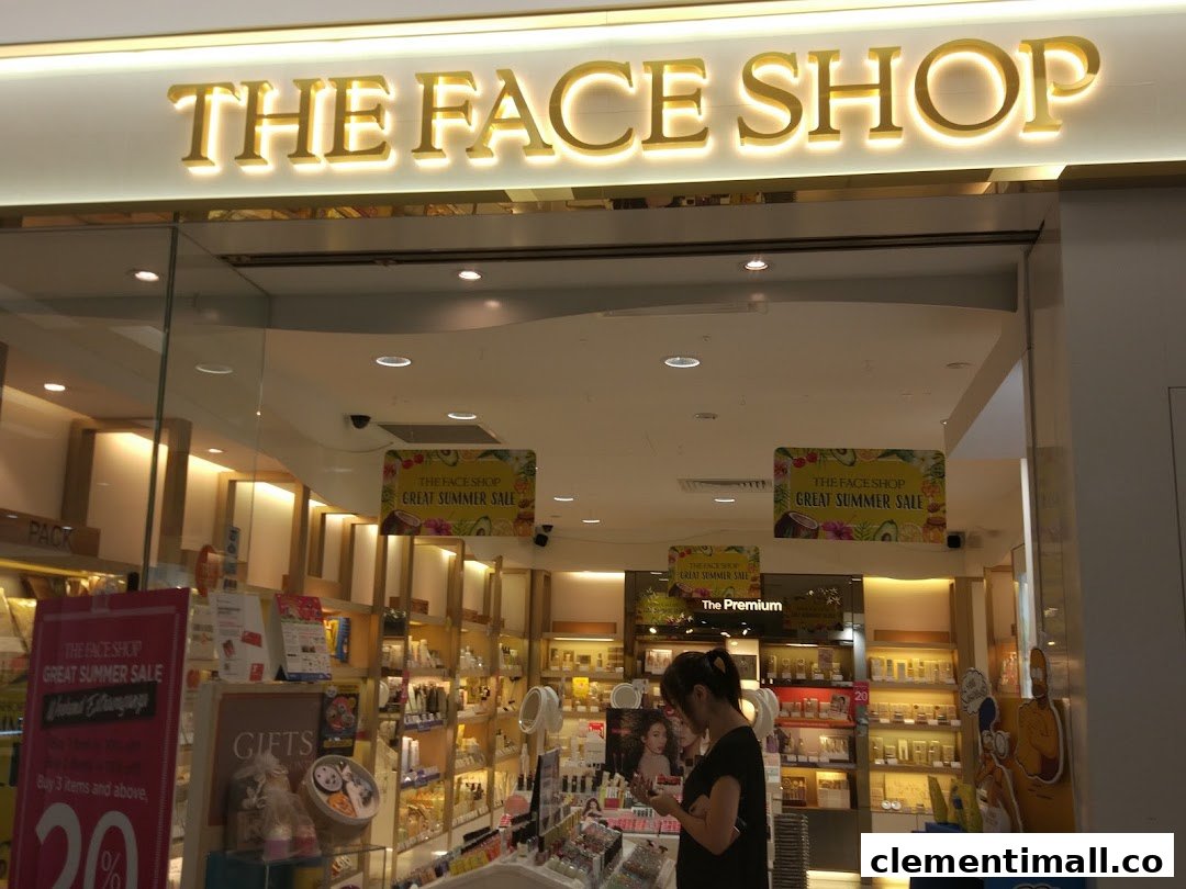 The bright entrance of THEFACESHOP, featuring its logo, interior displays, and a customer browsing products.