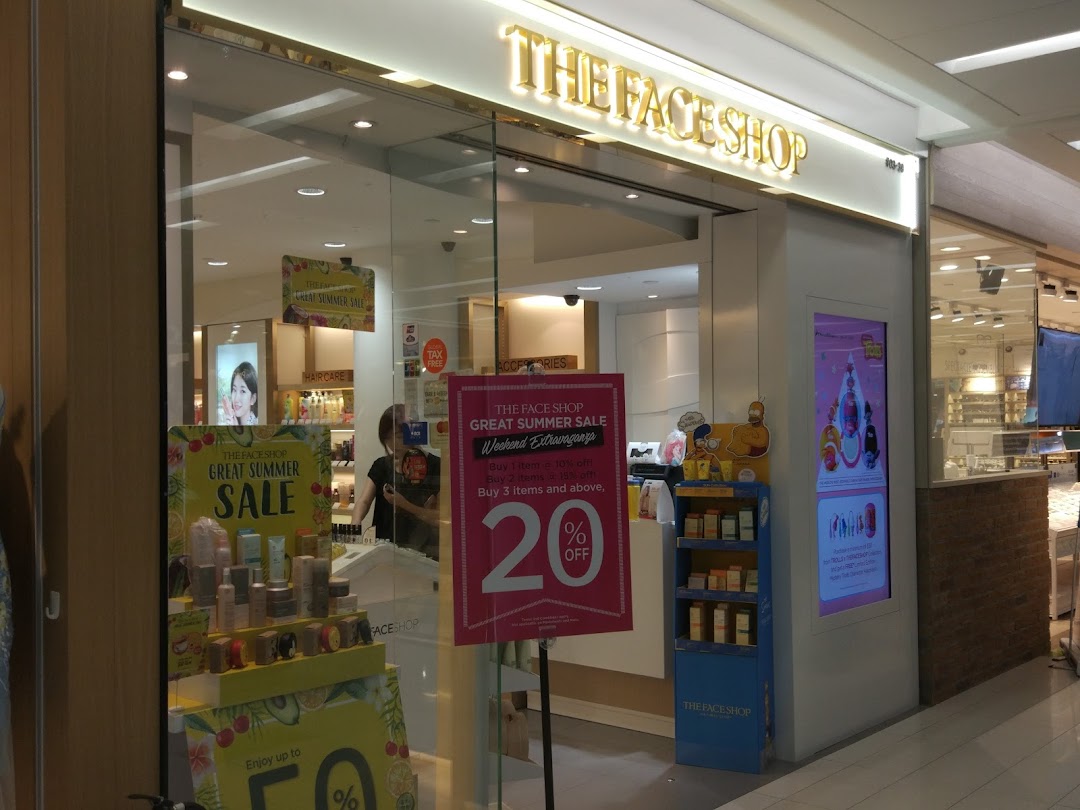The storefront of THEFACESHOP, featuring a 'Great Summer Sale' display and promotional offers.