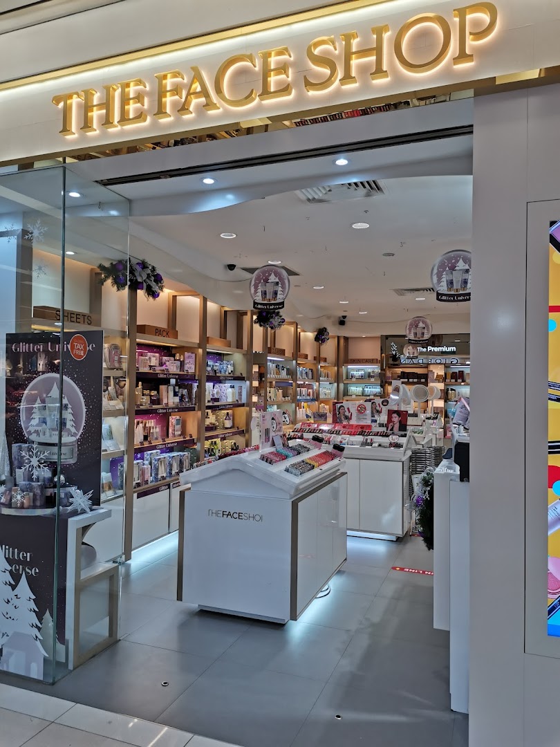 The brightly lit entrance of THEFACESHOP, showcasing beauty and skincare products.