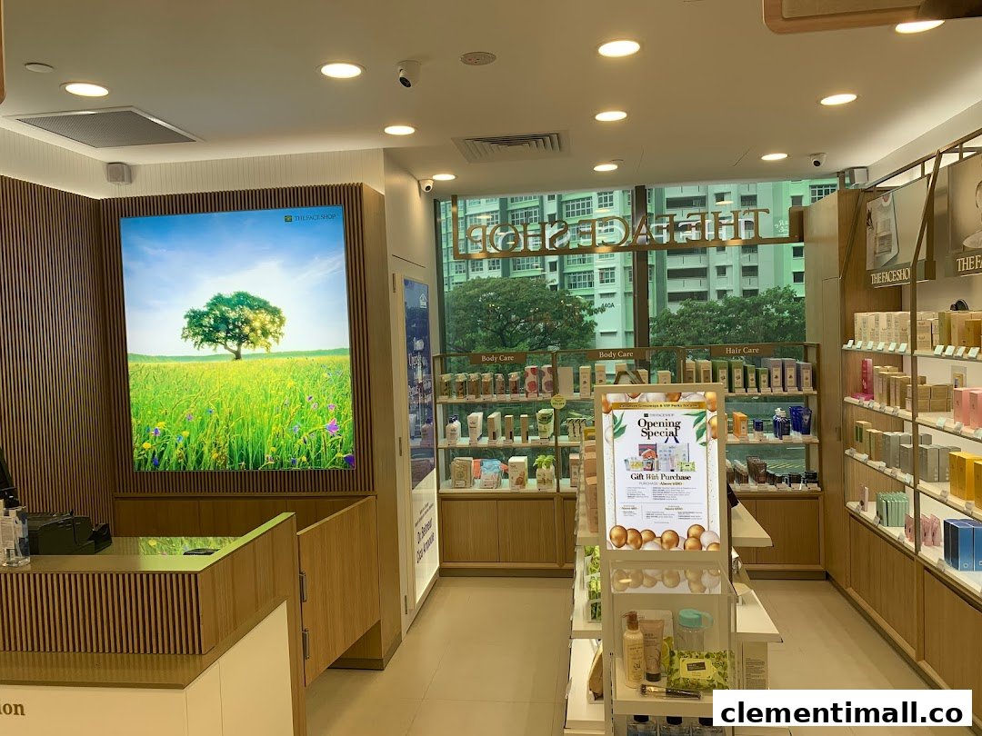 Interior view of THEFACESHOP, showcasing skincare and beauty products on display shelves and a bright nature-themed wall.