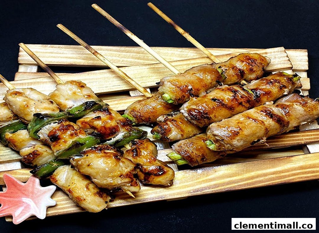 Delicious grilled skewers, including chicken and vegetable-wrapped meat, served on a rustic wooden tray.