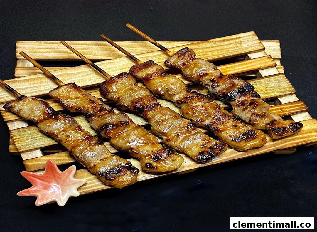 Delicious grilled meat skewers (yakitori) served on a rustic wooden tray.