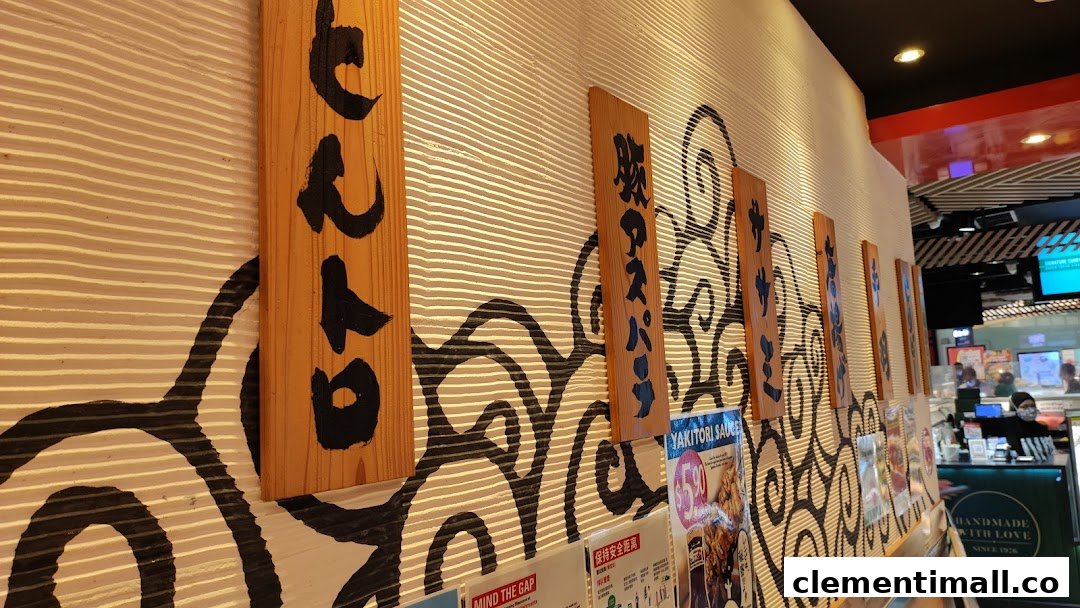 Interior view of TORI-Q's wall featuring decorative Japanese-style wooden signs and wave patterns.
