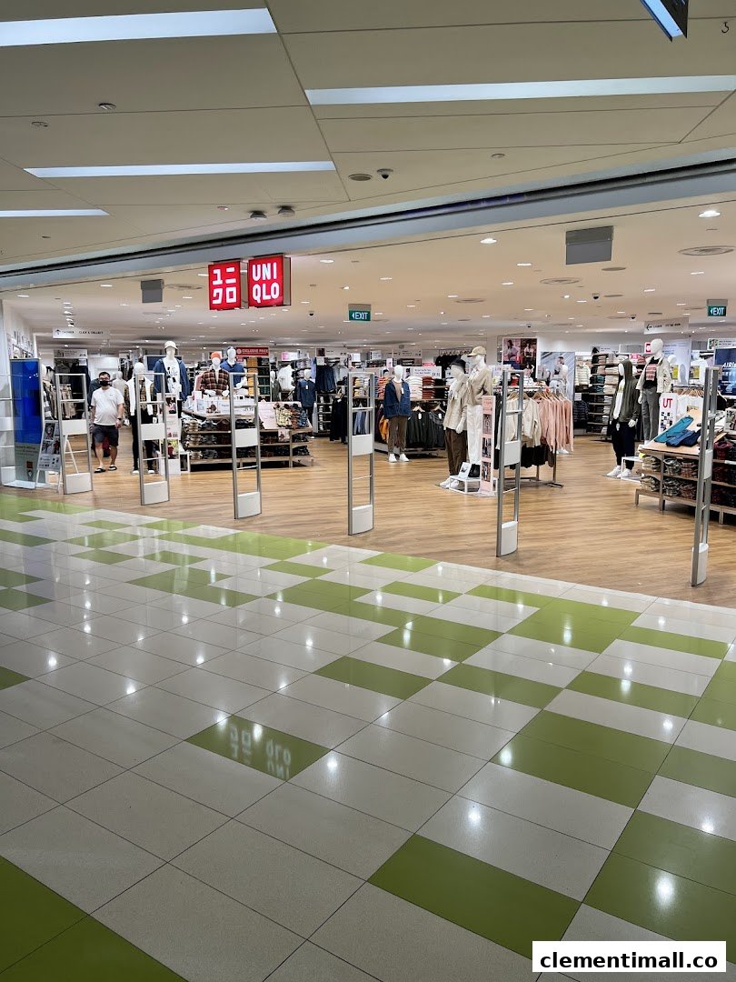 The inviting entrance of UNIQLO at The Clementi Mall, showcasing diverse fashion displays.
