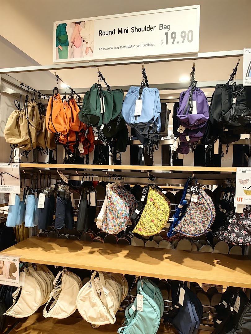 A vibrant display of Uniqlo's popular Round Mini Shoulder Bags in various colors and patterns.