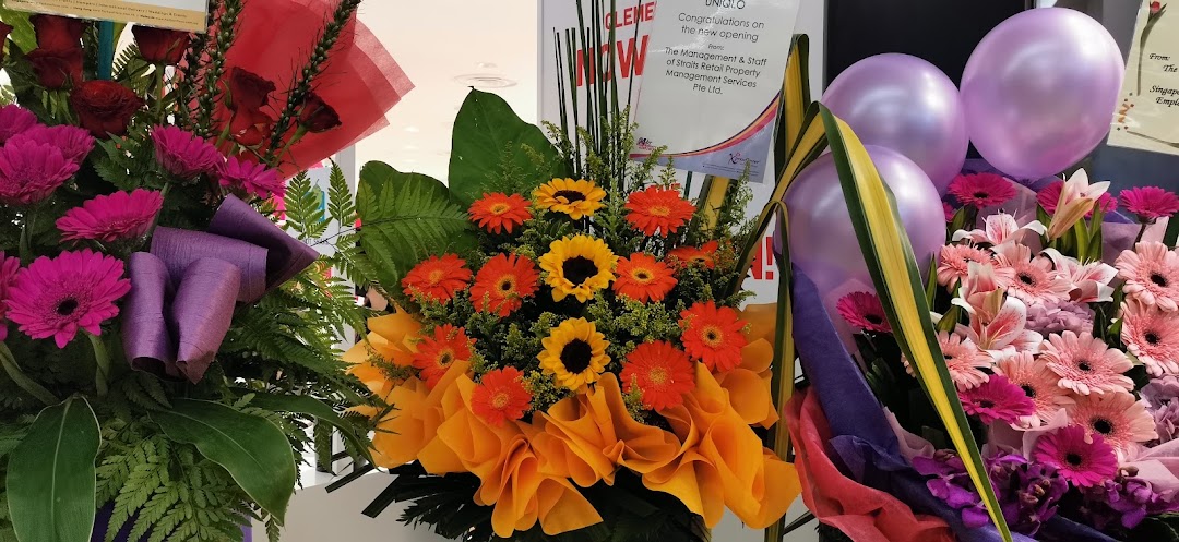 Vibrant floral arrangements and balloons celebrate the grand opening of UNIQLO at The Clementi Mall.