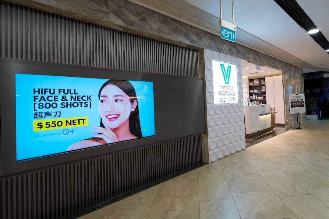 The modern storefront of V Medical Aesthetics & Laser Clinic, featuring a digital display promoting HIFU treatments.