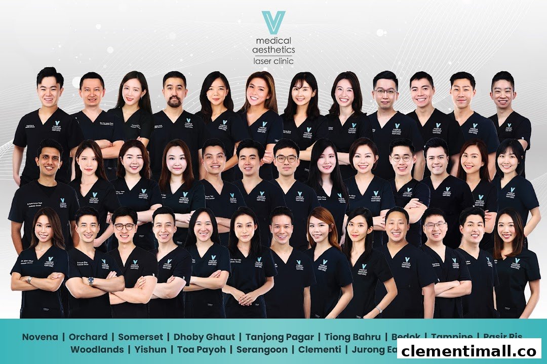 A large team of medical aesthetics and laser clinic professionals smiling for a group photo.