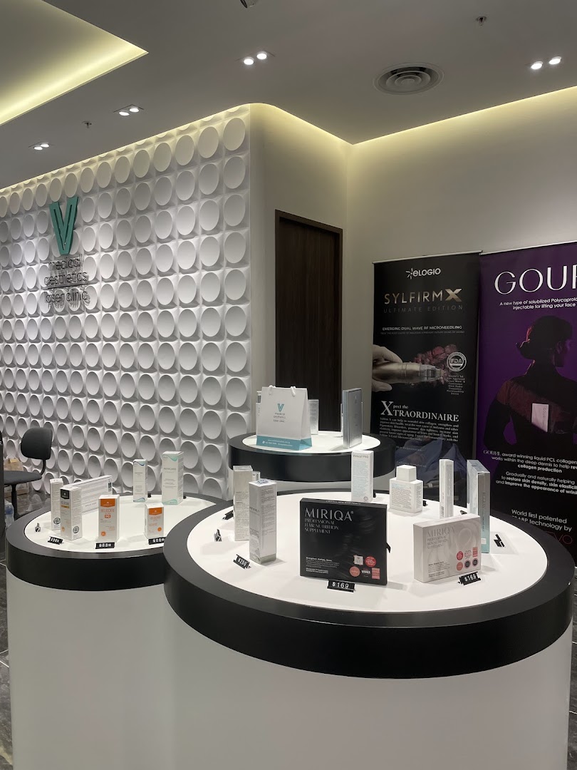 Interior view of V Medical Aesthetics & Laser Clinic, showcasing product displays and modern decor.