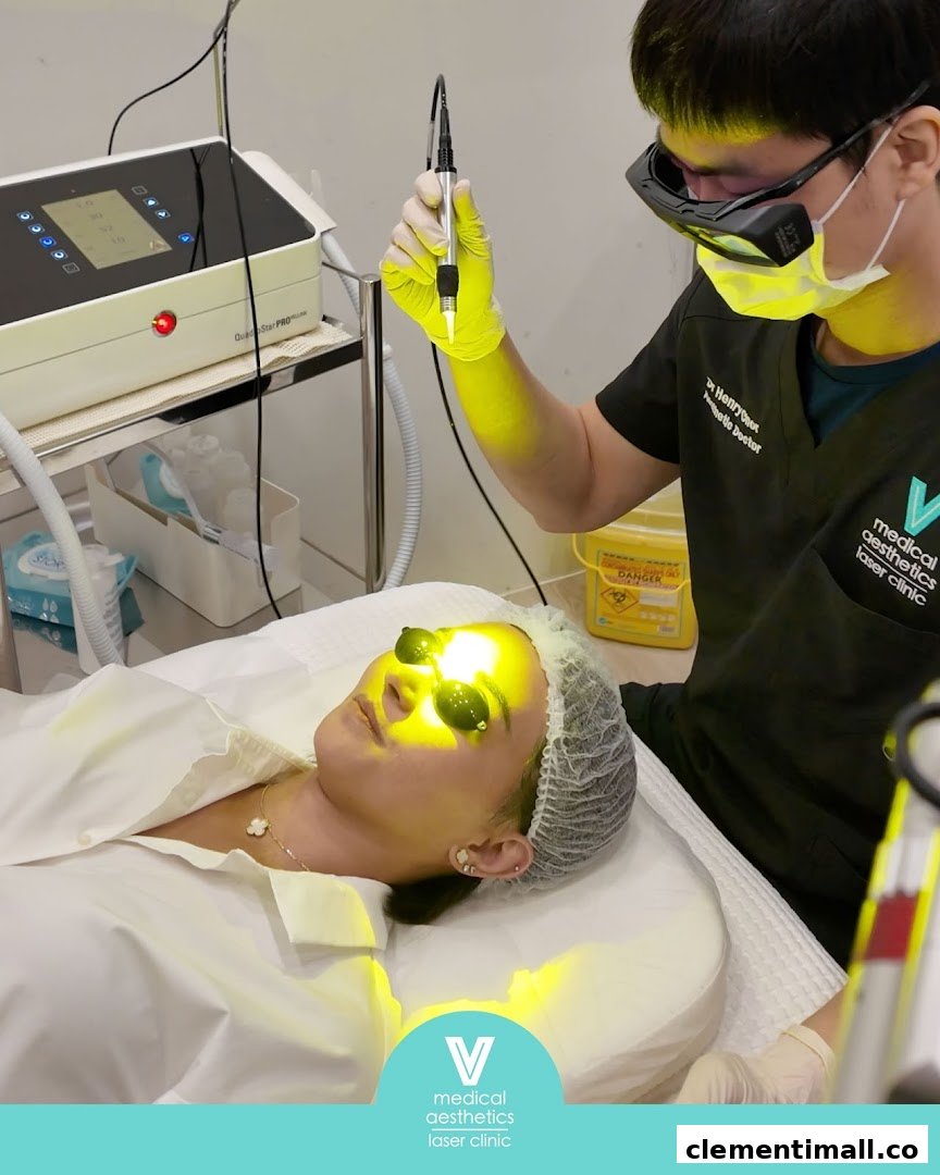 A patient receives a laser aesthetic treatment from a doctor at V Medical Aesthetics & Laser Clinic.