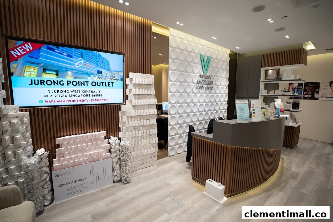 Interior view of V Medical Aesthetics Laser Clinic, featuring the reception desk, product displays, and a digital screen.