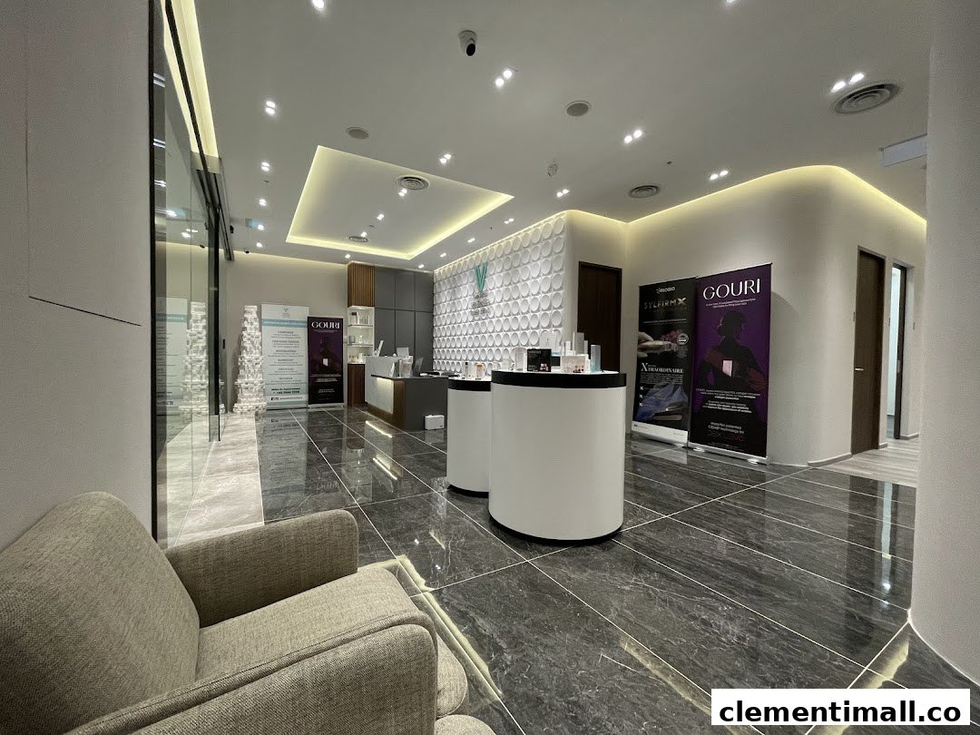 A modern, well-lit interior of V Medical Aesthetics & Laser Clinic, featuring a reception area and seating.