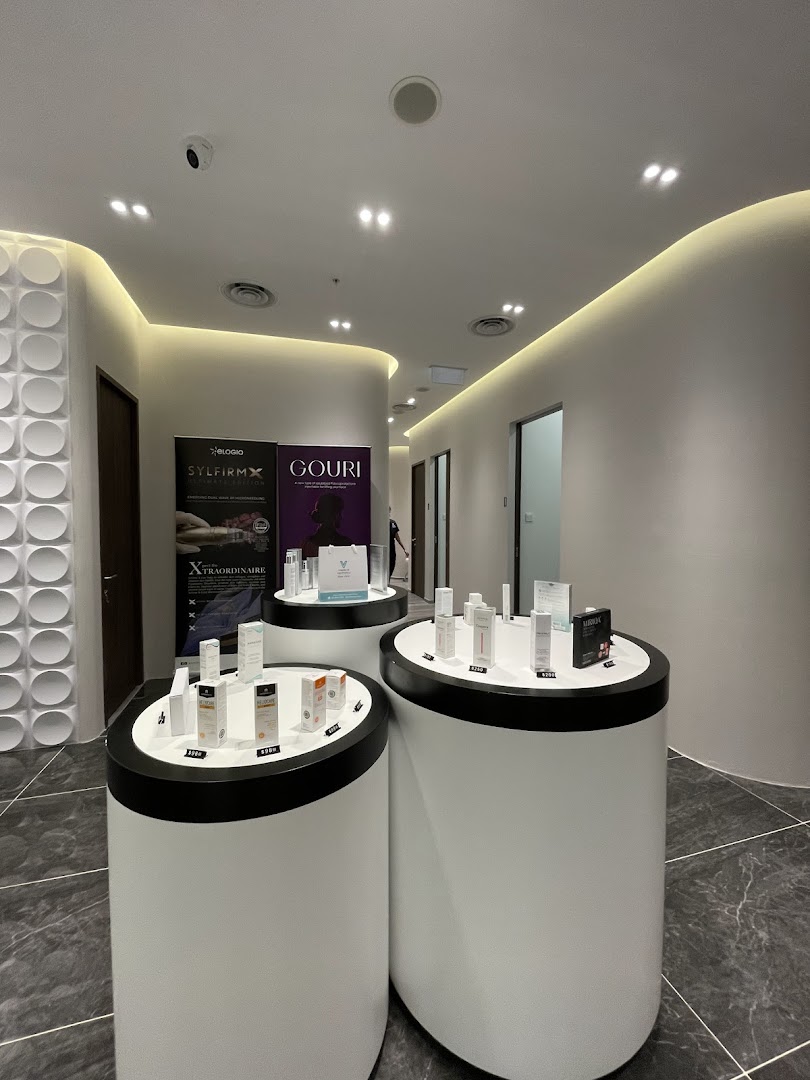 Interior view of V Medical Aesthetics & Laser Clinic, showcasing product displays and treatment banners.