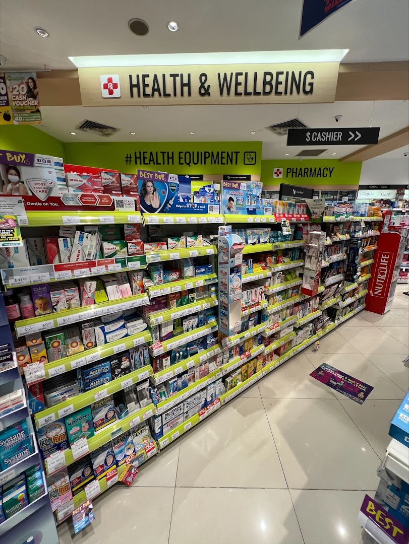 An interior view of Watsons pharmacy, showcasing shelves stocked with health and wellbeing products.