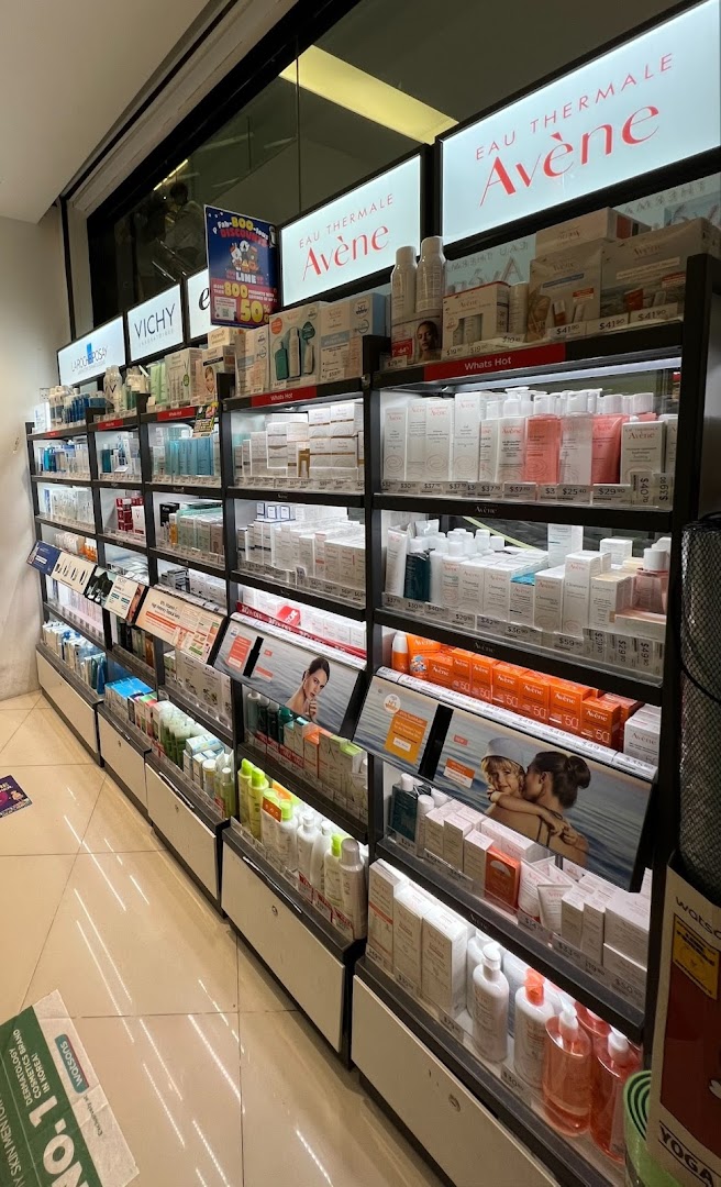 A well-lit aisle in Watsons, showcasing a wide range of skincare products from brands like Avène and Vichy.