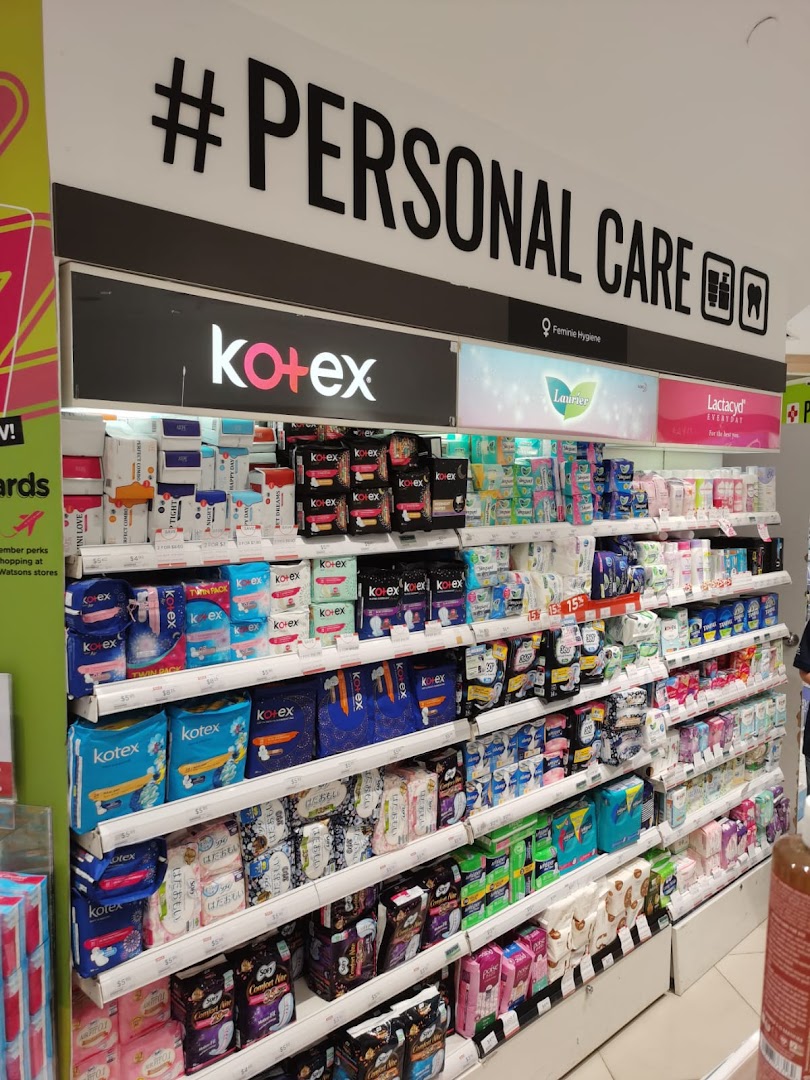 A well-stocked Watsons aisle featuring a wide range of personal care and feminine hygiene products.