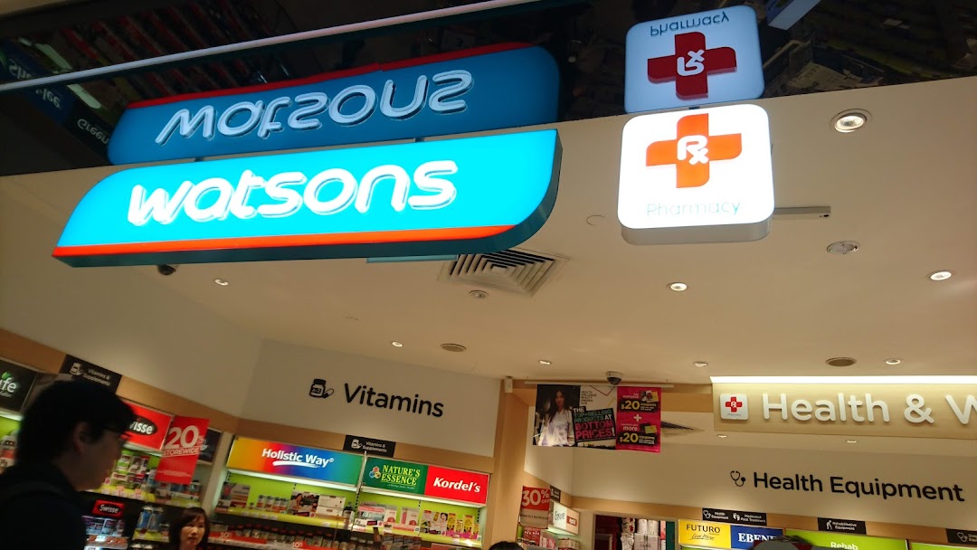 Interior view of a Watsons pharmacy, showcasing health, wellness, and vitamin sections with prominent signage.