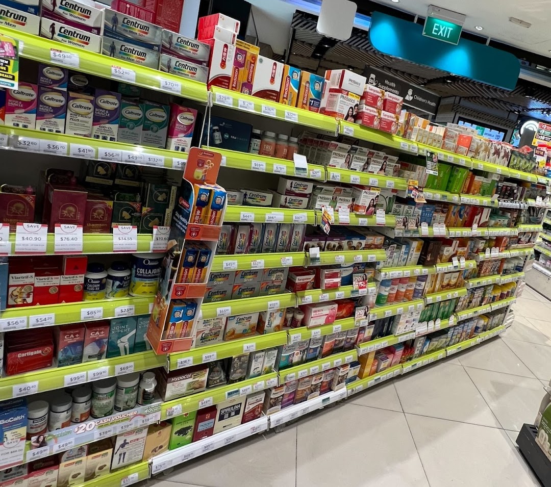 An aisle in a Watsons pharmacy, stocked with various health supplements and vitamins.